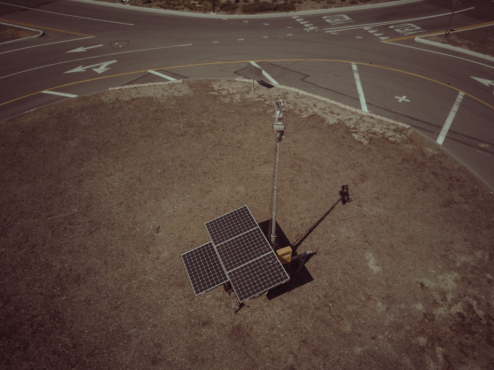 solar panels near a concrete road